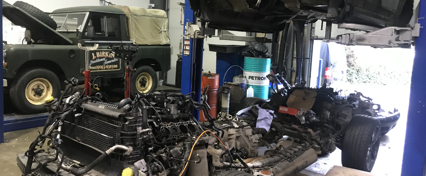 Mechanic under a vehicle - Car Repairs Sawston